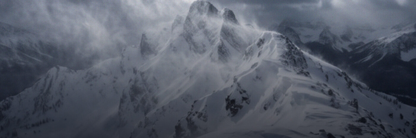 Aurora over snow-covered mountains