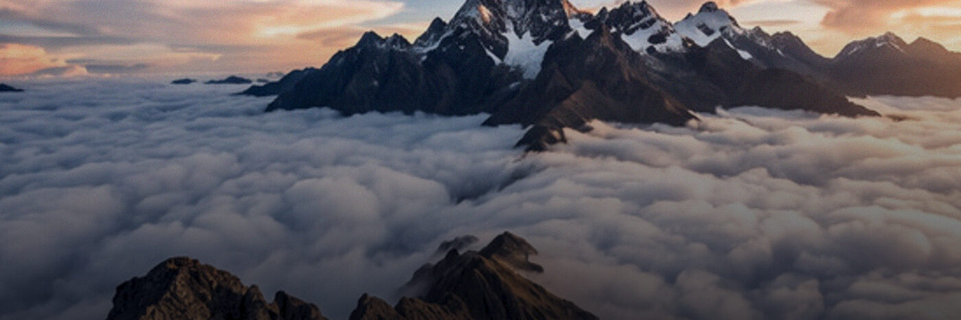 A sea of cloud below mountain peaks