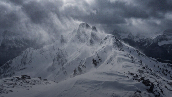 Aurora over snow-covered mountains