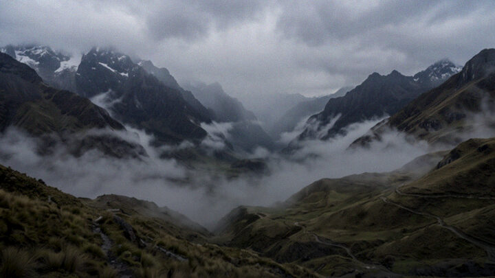 Mist rolling across high Andean peaks